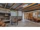 Enclosed patio with corrugated metal roof, wooden beams, and a custom grill area, perfect for outdoor entertaining and relaxing at 4002 Phylis Pl, Decatur, GA 30035