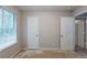 Bedroom with bare floors, window and closet doors at 5856 Rock Rd, Union City, GA 30291