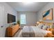 Serene bedroom featuring a cozy bed, dresser, and modern decor at 5856 Rock Rd, Union City, GA 30291