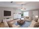 Inviting living room with a vaulted ceiling, fireplace, and neutral-toned furniture at 5856 Rock Rd, Union City, GA 30291