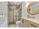 New bathroom with tiled walk-in shower, glass divider, and modern vanity at 604 Continental Dr, Lawrenceville, GA 30044