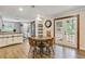 Bright dining area with a table for four, hardwood floors, and French doors leading to the outdoors at 604 Continental Dr, Lawrenceville, GA 30044