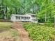 Charming two-story home with front porch and well-manicured landscaping at 604 Continental Dr, Lawrenceville, GA 30044