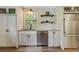 Kitchen with stainless steel dishwasher, ample cabinet space, subway tile, and a window providing natural light at 604 Continental Dr, Lawrenceville, GA 30044