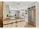 Beautiful kitchen with a center island, stainless steel appliances, custom cabinets, and plenty of natural light at 604 Continental Dr, Lawrenceville, GA 30044