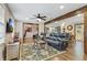 Bright living room featuring beautiful wood beam accents, lots of natural light, and a comfortable seating area at 604 Continental Dr, Lawrenceville, GA 30044