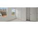 Bedroom featuring large windows, neutral carpeting and three doors at 119 Champions Blvd., Dallas, GA 30157