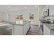 Bright kitchen featuring stainless steel appliances, granite countertops, and a large island with bar seating at 119 Champions Blvd., Dallas, GA 30157