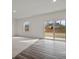 Bright living room with neutral carpet, hard wood and sliding doors to backyard at 119 Champions Blvd., Dallas, GA 30157