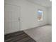 Bright living room featuring plush carpeting and a large front door at 119 Champions Blvd., Dallas, GA 30157