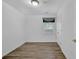 Bedroom featuring wood-look flooring, a window with blinds, and closet at 148 Hurt Road Sw, Smyrna, GA 30082
