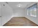 Neutral bedroom with wood-look flooring, large window, and ample closet space at 148 Hurt Road Sw, Smyrna, GA 30082