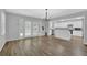 Bright living and kitchen area with hardwood floors and modern fixtures at 148 Hurt Road Sw, Smyrna, GA 30082