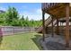 Backyard features a lush green lawn with stairs leading to a deck and a privacy fence at 1608 Indian Way, Cumming, GA 30040