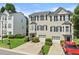 Charming townhome featuring a well-manicured lawn, one-car garage, and traditional design at 1608 Indian Way, Cumming, GA 30040