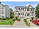 Charming townhome featuring a well-manicured lawn, one-car garage, and traditional design at 1608 Indian Way, Cumming, GA 30040