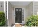 Inviting front door with a welcoming mat and charming details at 1608 Indian Way, Cumming, GA 30040