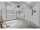 Spacious garage with roll up door and ample lighting and storage at 1608 Indian Way, Cumming, GA 30040