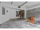 Unfinished garage space with concrete floor, exposed brick, and ample storage at 1608 Indian Way, Cumming, GA 30040