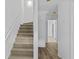 Bright hallway with hardwood floors and stairs at 1608 Indian Way, Cumming, GA 30040