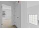 Hallway with entrance to bedroom and staircase with window at 1608 Indian Way, Cumming, GA 30040