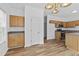 Bright kitchen with wood cabinets, stainless steel appliances, and wood-look flooring at 1608 Indian Way, Cumming, GA 30040
