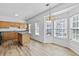 Well-lit kitchen with hardwood floors, stainless steel appliances, and a bay window for natural light at 1608 Indian Way, Cumming, GA 30040