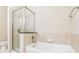 Bathroom featuring tiled shower and soaking tub at 3621 Vinings Slope Se # 3510, Atlanta, GA 30339