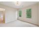 Bright bedroom featuring carpet floors and large windows with green views at 3621 Vinings Slope Se # 3510, Atlanta, GA 30339