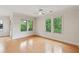 Bright bedroom featuring hardwood floors and large windows with green views at 3621 Vinings Slope Se # 3510, Atlanta, GA 30339