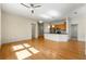 Spacious living room featuring hardwood floors and a view of the kitchen at 3621 Vinings Slope Se # 3510, Atlanta, GA 30339