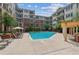 Pool area surrounded by lounge chairs, landscaping and building at 3621 Vinings Slope Se # 3510, Atlanta, GA 30339