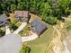 Aerial view shows a home with mature trees and landscaping near a cul-de-sac at 5285 Winflow Way, Suwanee, GA 30024