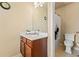 Well-lit bathroom with vanity and shower-tub combo, with neutral paint at 5285 Winflow Way, Suwanee, GA 30024