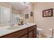Bathroom featuring double sinks, spacious counters, and a shower-tub combo at 5285 Winflow Way, Suwanee, GA 30024