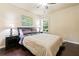 Comfortable bedroom with hardwood floors, a ceiling fan, and a window with blinds at 5285 Winflow Way, Suwanee, GA 30024