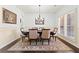 Elegant dining room features a large table and sophisticated decor at 5285 Winflow Way, Suwanee, GA 30024