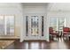 Inviting foyer features an ornate front door and shuttered windows at 5285 Winflow Way, Suwanee, GA 30024