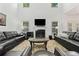 Bright living room with high ceilings, fireplace, and large windows at 5285 Winflow Way, Suwanee, GA 30024