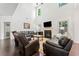 Bright living room boasts high ceilings and a cozy fireplace at 5285 Winflow Way, Suwanee, GA 30024