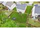 Aerial view of the backyard featuring a trampoline and lush green lawn at 6360 Boulder Rdg, Cumming, GA 30028
