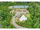 Aerial view featuring a community pool, tennis courts, playground and landscaping at 6360 Boulder Rdg, Cumming, GA 30028
