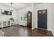 Bright entryway with hardwood floors, stylish furniture, and a decorative chandelier at 6360 Boulder Rdg, Cumming, GA 30028