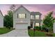 Charming two-story home with a manicured lawn and a two-car garage, offering curb appeal at 6360 Boulder Rdg, Cumming, GA 30028