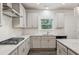 Well-equipped kitchen featuring gray cabinets, stainless steel appliances, and sleek countertops at 6360 Boulder Rdg, Cumming, GA 30028