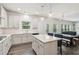 Bright and open kitchen with stainless steel appliances and center island with pendant lights at 6360 Boulder Rdg, Cumming, GA 30028