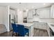 Stylish kitchen featuring stainless steel appliances, island with seating, and ample cabinet space at 6360 Boulder Rdg, Cumming, GA 30028
