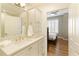 Bright bathroom with quartz countertop and door to bedroom at 1101 Juniper Ne St # 632, Atlanta, GA 30309