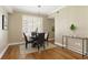 Dining area with hardwood floors, modern lighting, and neutral decor at 1101 Juniper Ne St # 632, Atlanta, GA 30309