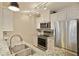 Well-lit kitchen featuring stainless steel appliances, granite countertops, ample cabinet space, and a stainless-steel sink at 1101 Juniper Ne St # 632, Atlanta, GA 30309